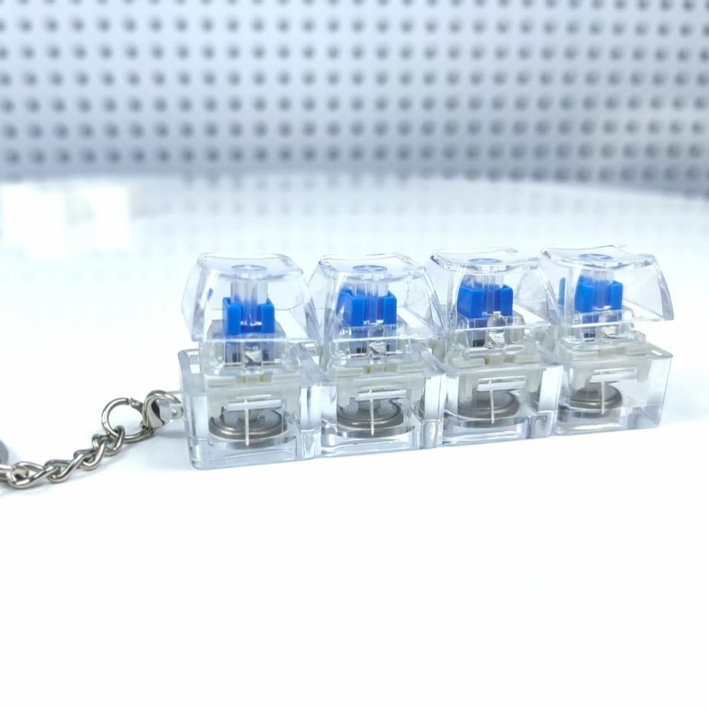 Chaveiro Teclado Mecânico 4 Teclas - Brinquedo Anti-Stress Luminoso com Botões Transparentes